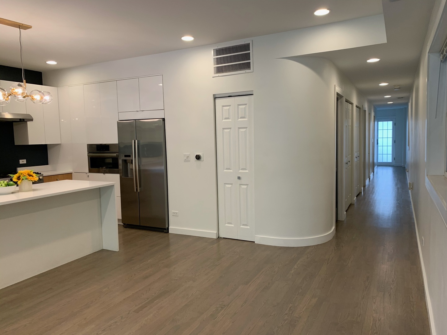 1048 West Fulton Street, Unit 2 Chicago, IL 60607 - Photo 11 of 22 a view of a refrigerator in kitchen and wooden floor