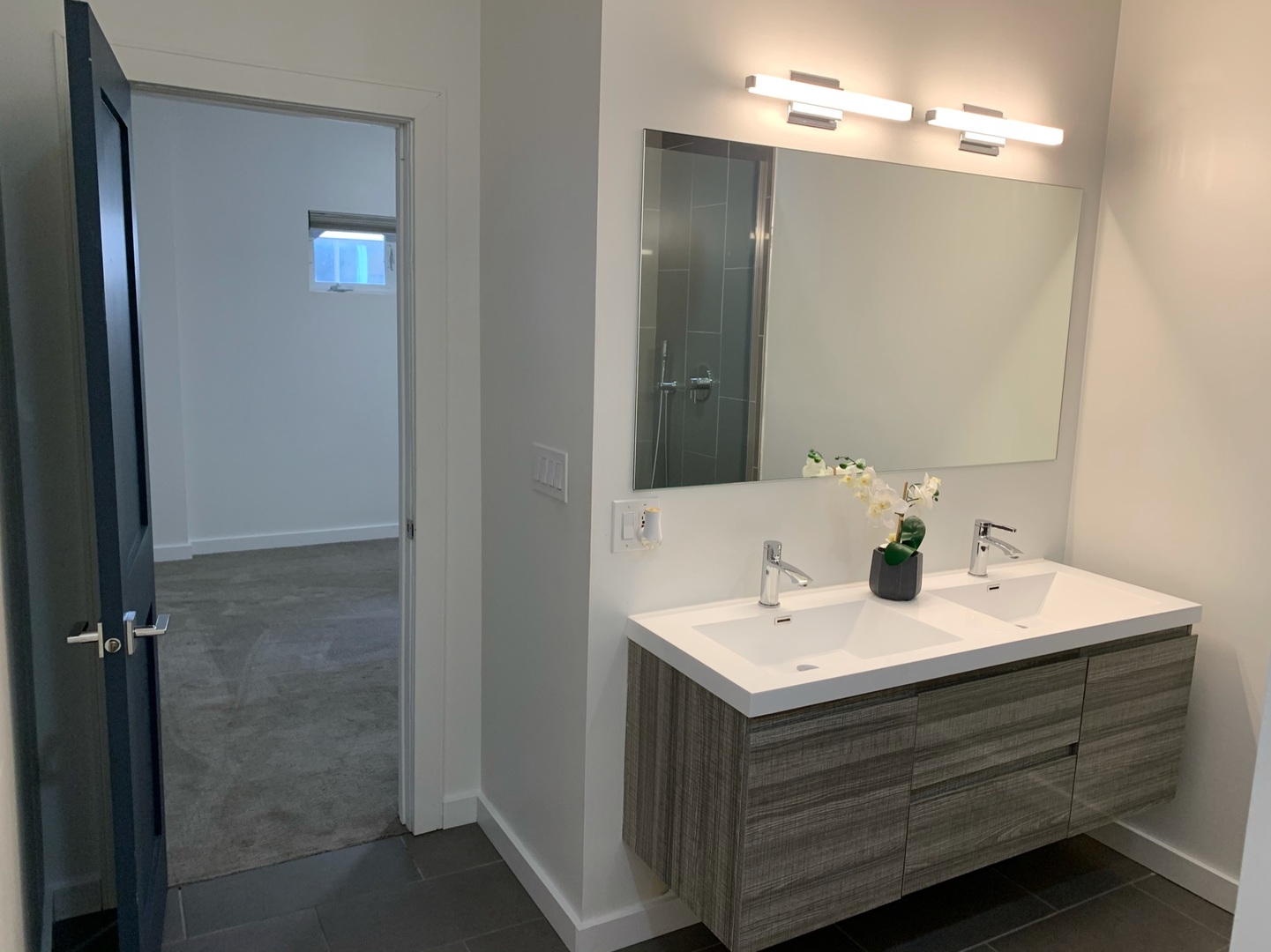 1048 West Fulton Street, Unit 2 Chicago, IL 60607 - Photo 14 of 22 a bathroom with a sink vanity and mirror