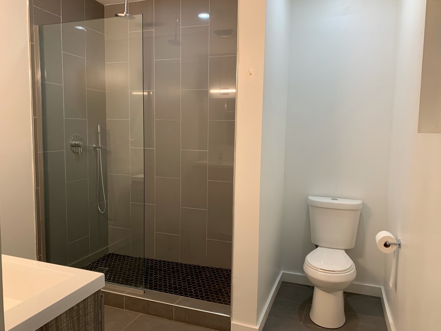 1048 West Fulton Street, Unit 2 Chicago, IL 60607 - Photo 15 of 22 a bathroom with a toilet and a shower