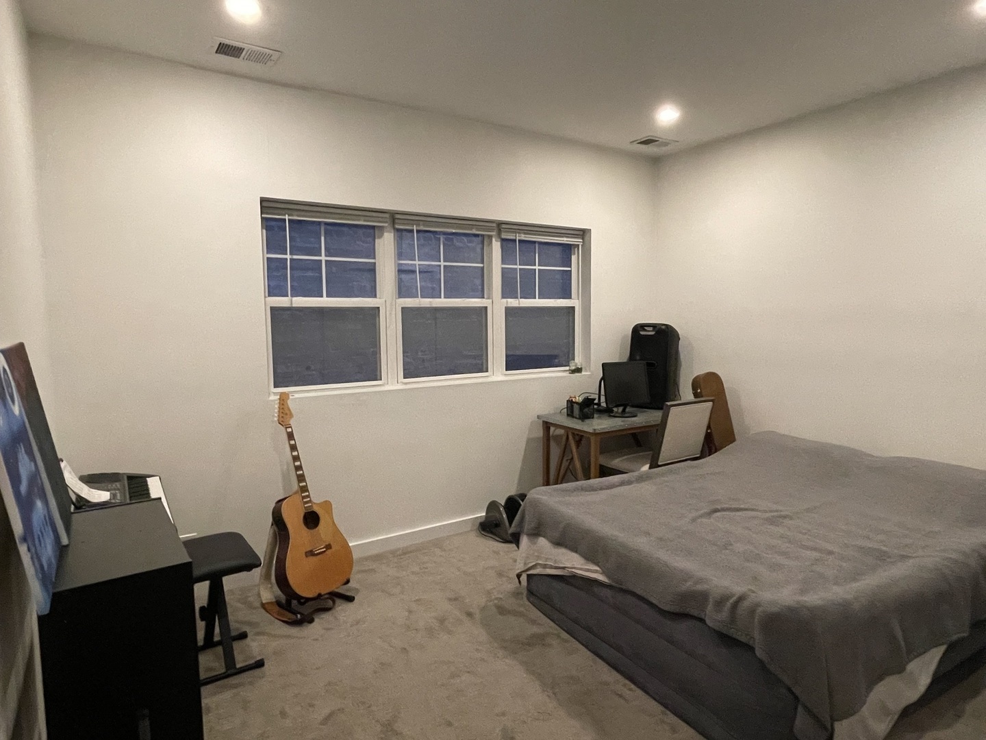 1048 West Fulton Street, Unit 2 Chicago, IL 60607 - Photo 18 of 22 a bedroom with a bed and wooden floor