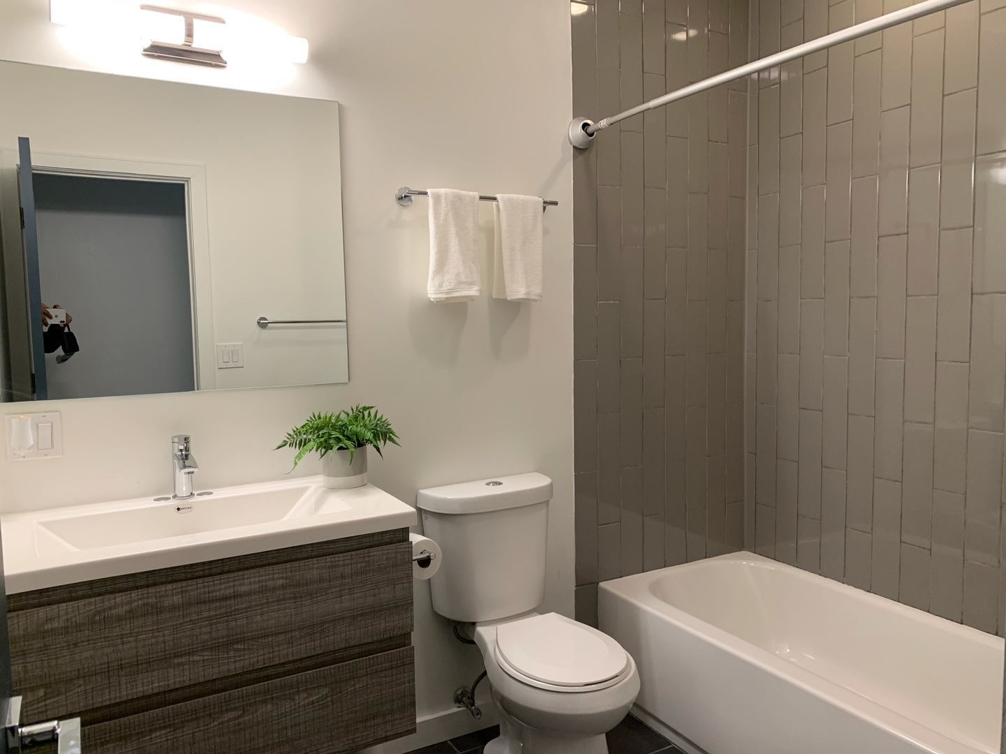 1048 West Fulton Street, Unit 2 Chicago, IL 60607 - Photo 20 of 22 a bathroom with a sink a toilet a mirror and shower