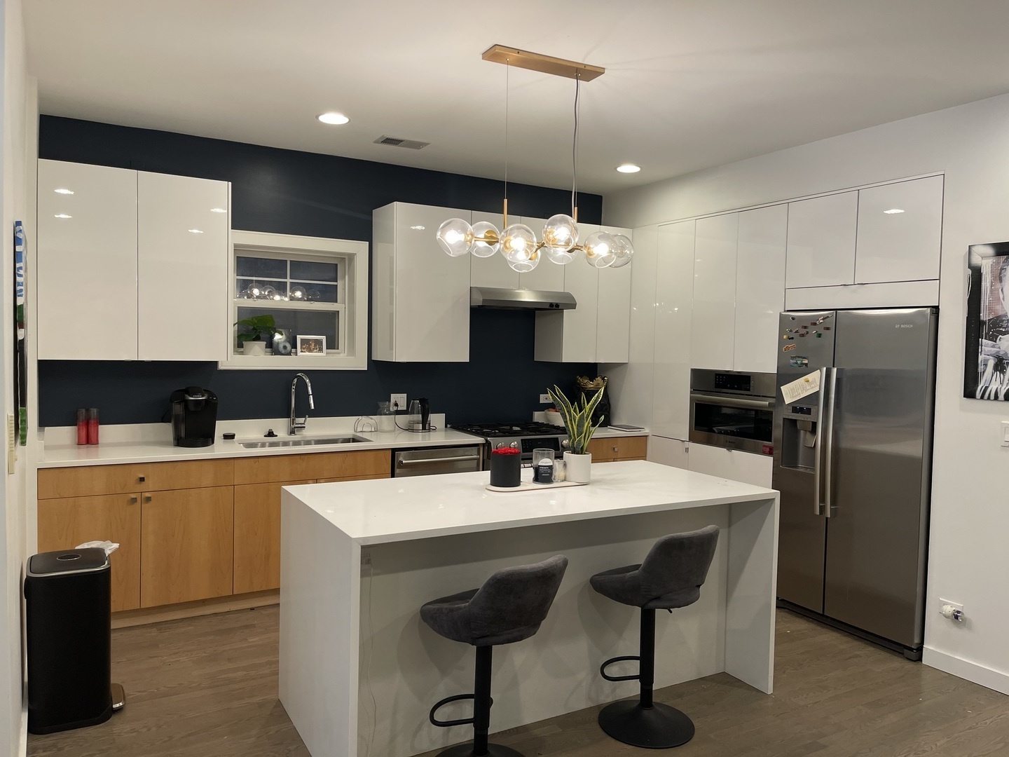 1048 West Fulton Street, Unit 2 Chicago, IL 60607 - Photo 6 of 22 a kitchen with a center island and cabinets