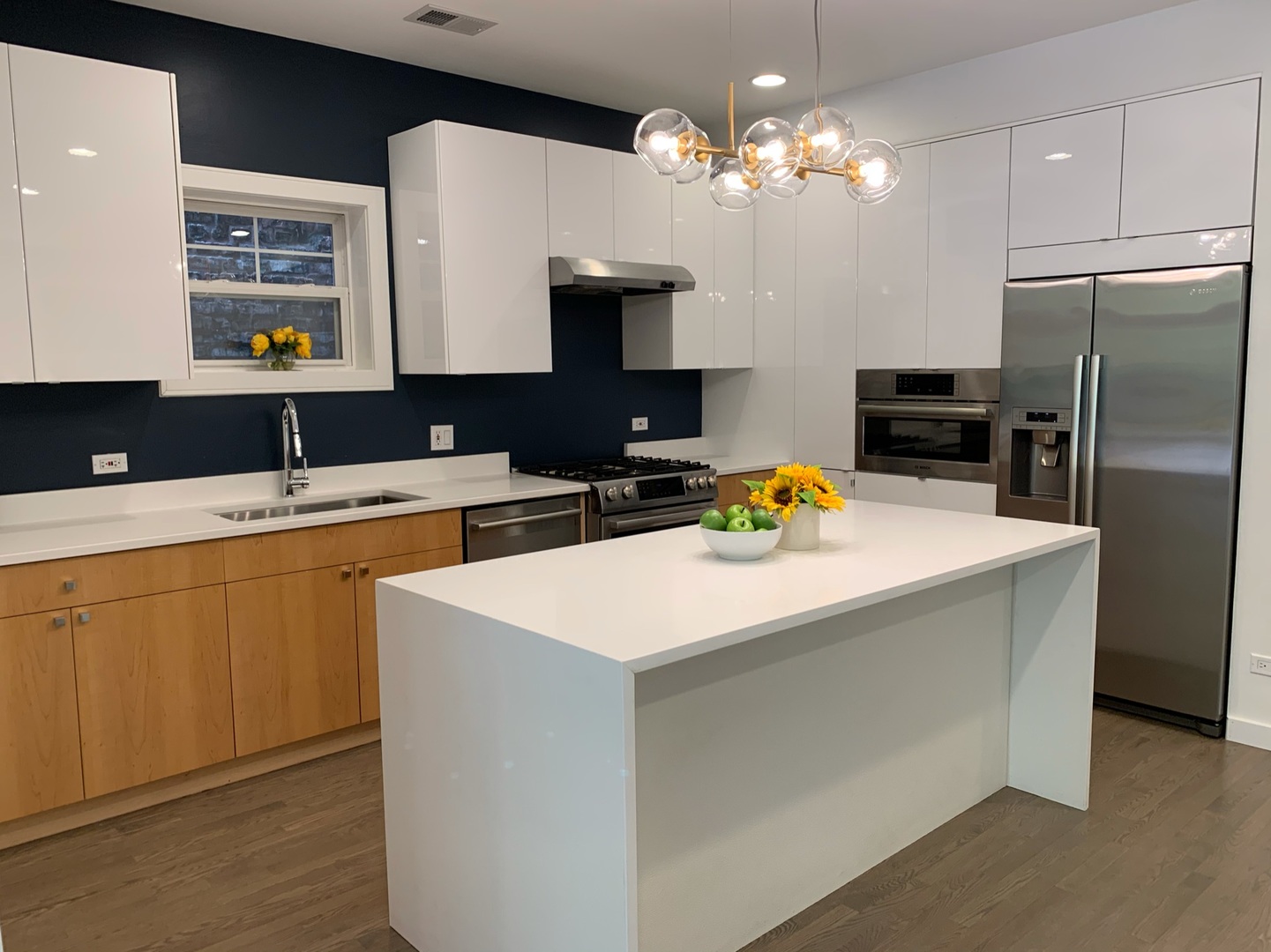 1048 West Fulton Street, Unit 2 Chicago, IL 60607 - Photo 8 of 22 a kitchen that has a lot of cabinets a sink and a stove