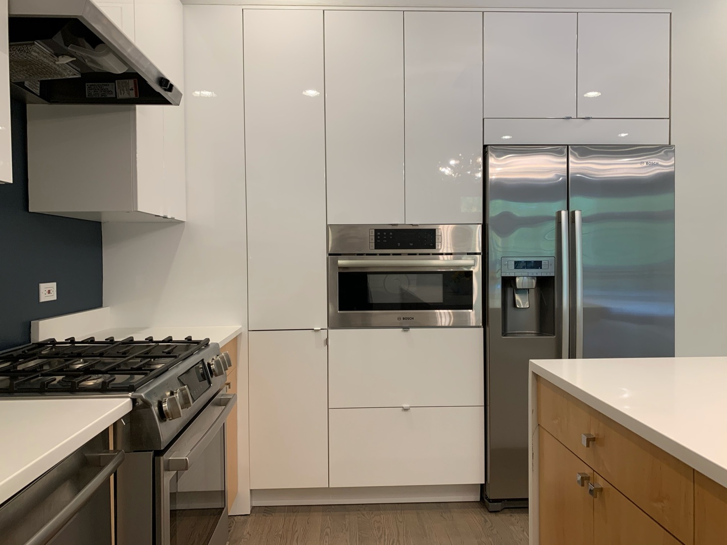 1048 West Fulton Street, Unit 2 Chicago, IL 60607 - Photo 10 of 22 a kitchen with stainless steel appliances a refrigerator a sink and white cabinets