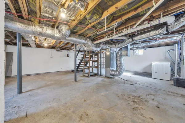 a view of empty room with wooden ceiling