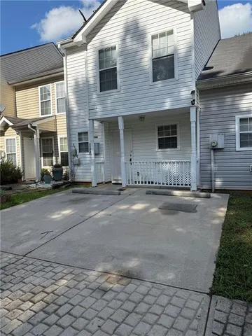 a view of a house with a street