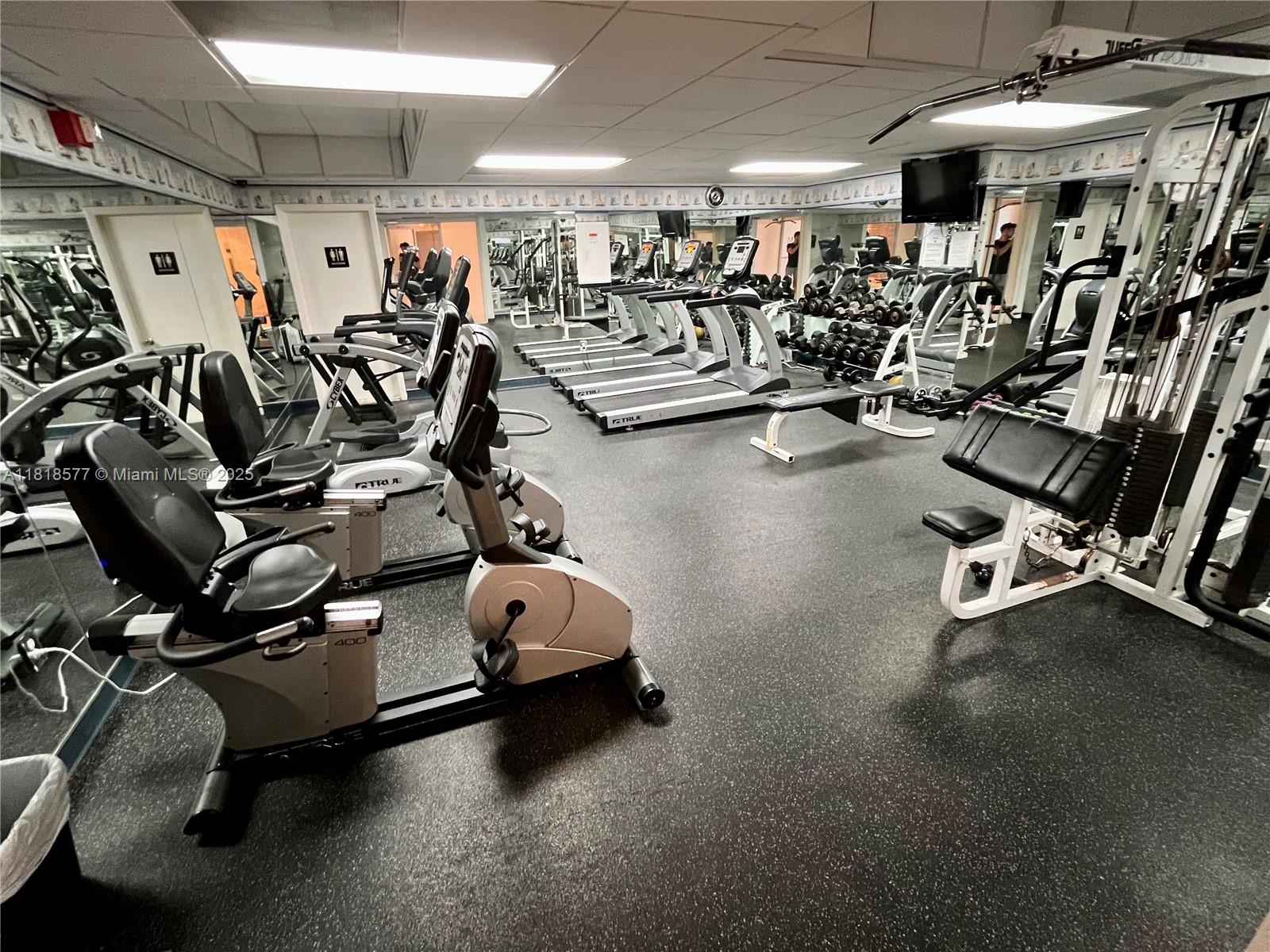 2899 Collins Avenue, Unit 810 Miami Beach, FL 33140 - Photo 31 of 36 a view of a room with gym equipment
