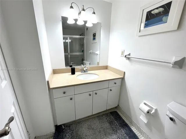a spacious bathroom with a double vanity sink and a mirror