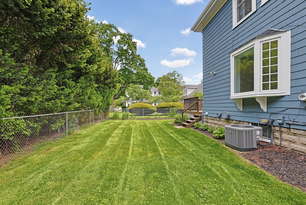 10 Water Street Natick, MA 01760 - Photo 31 of 35 a view of a backyard with a patio