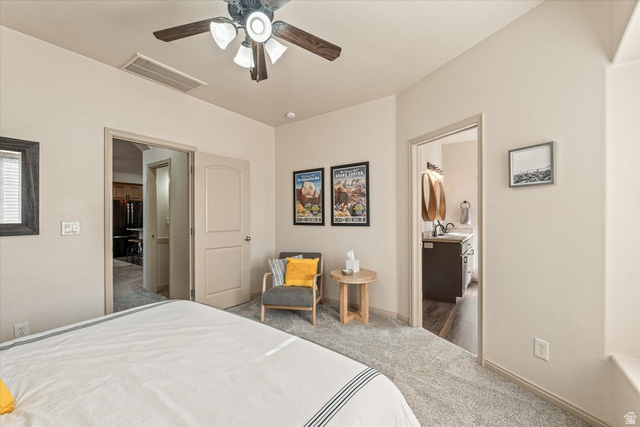 345 North 2450th Street East, Unit 152 St. George, UT 84790 - Photo 18 of 40 Carpeted bedroom with a ceiling fan and baseboards