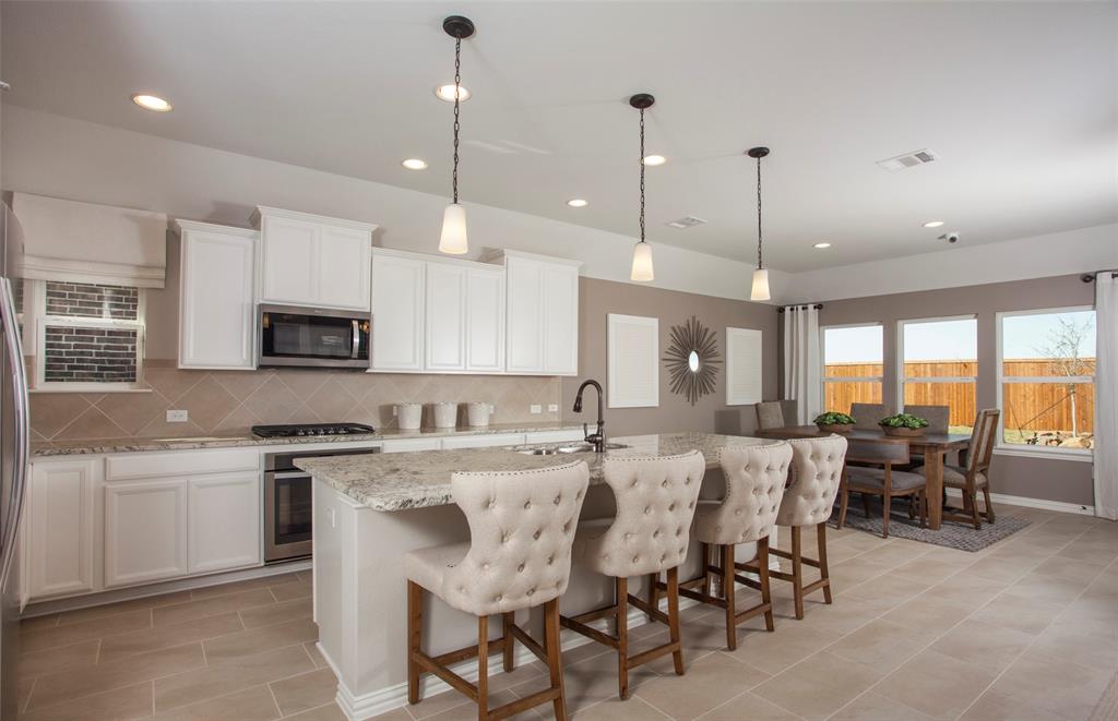 4380 Noble Lane Midlothian, TX 76065 - Photo 9 of 11 a large kitchen with a table and chairs