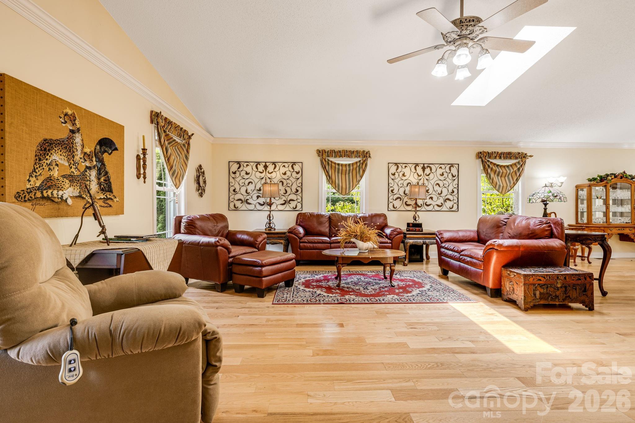 350 Old Sunset Hill Road Hendersonville, NC 28792 - Photo 12 of 40 a living room with furniture potted plant and a window