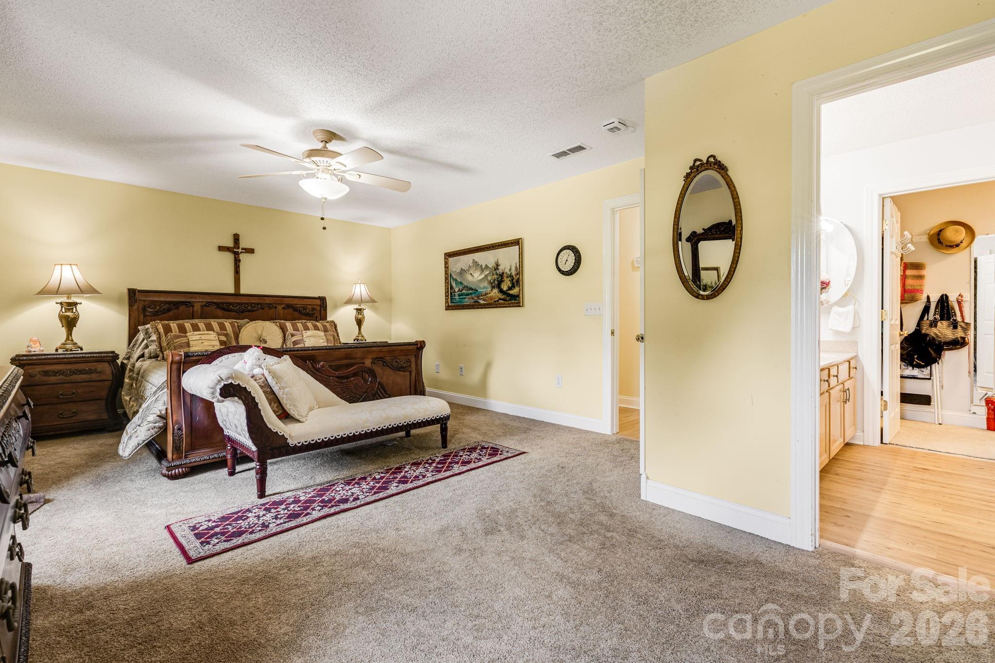 350 Old Sunset Hill Road Hendersonville, NC 28792 - Photo 15 of 40 a bedroom with furniture and a large mirror