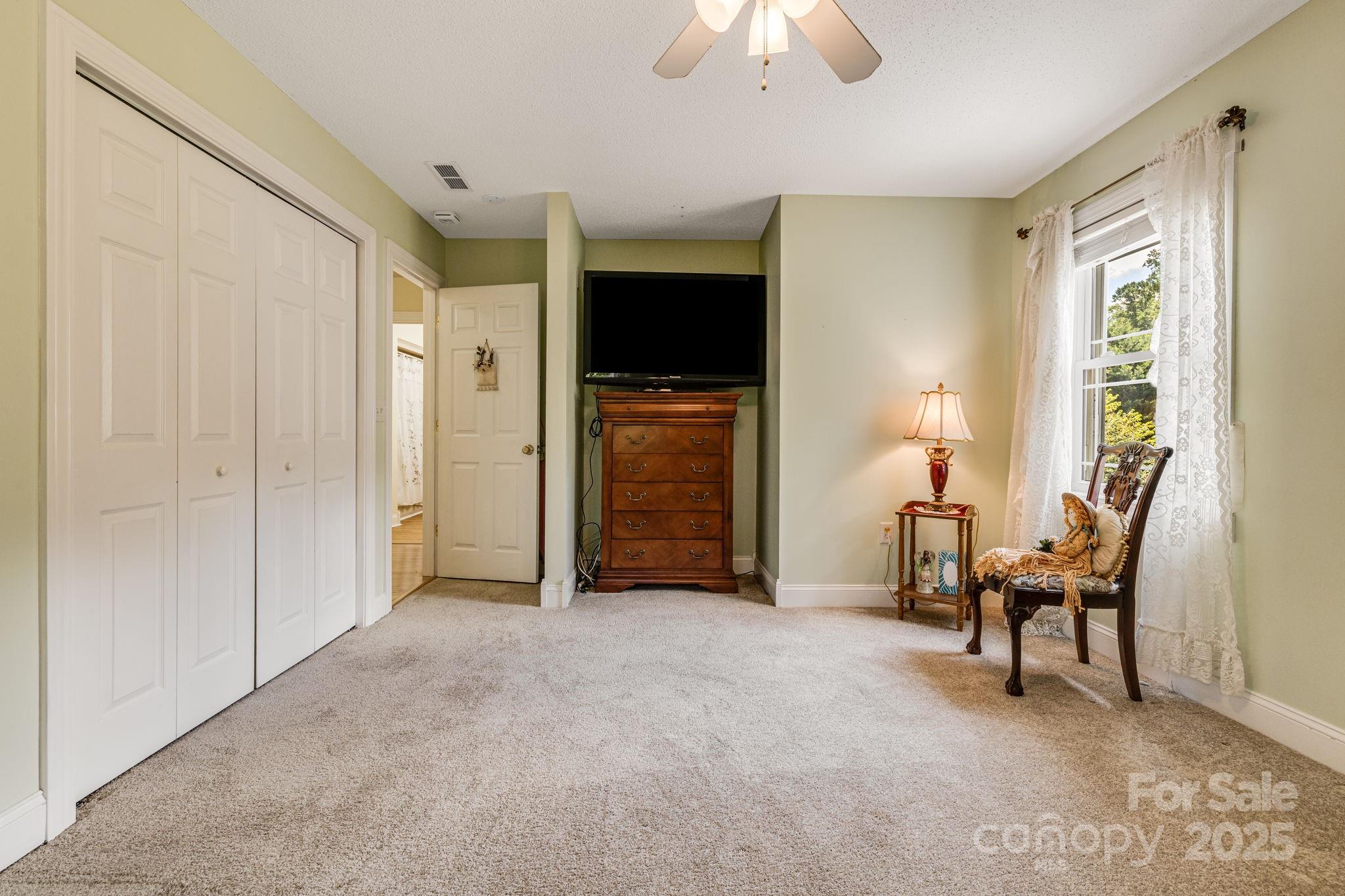 350 Old Sunset Hill Road Hendersonville, NC 28792 - Photo 19 of 40 a view of a livingroom with furniture and a window