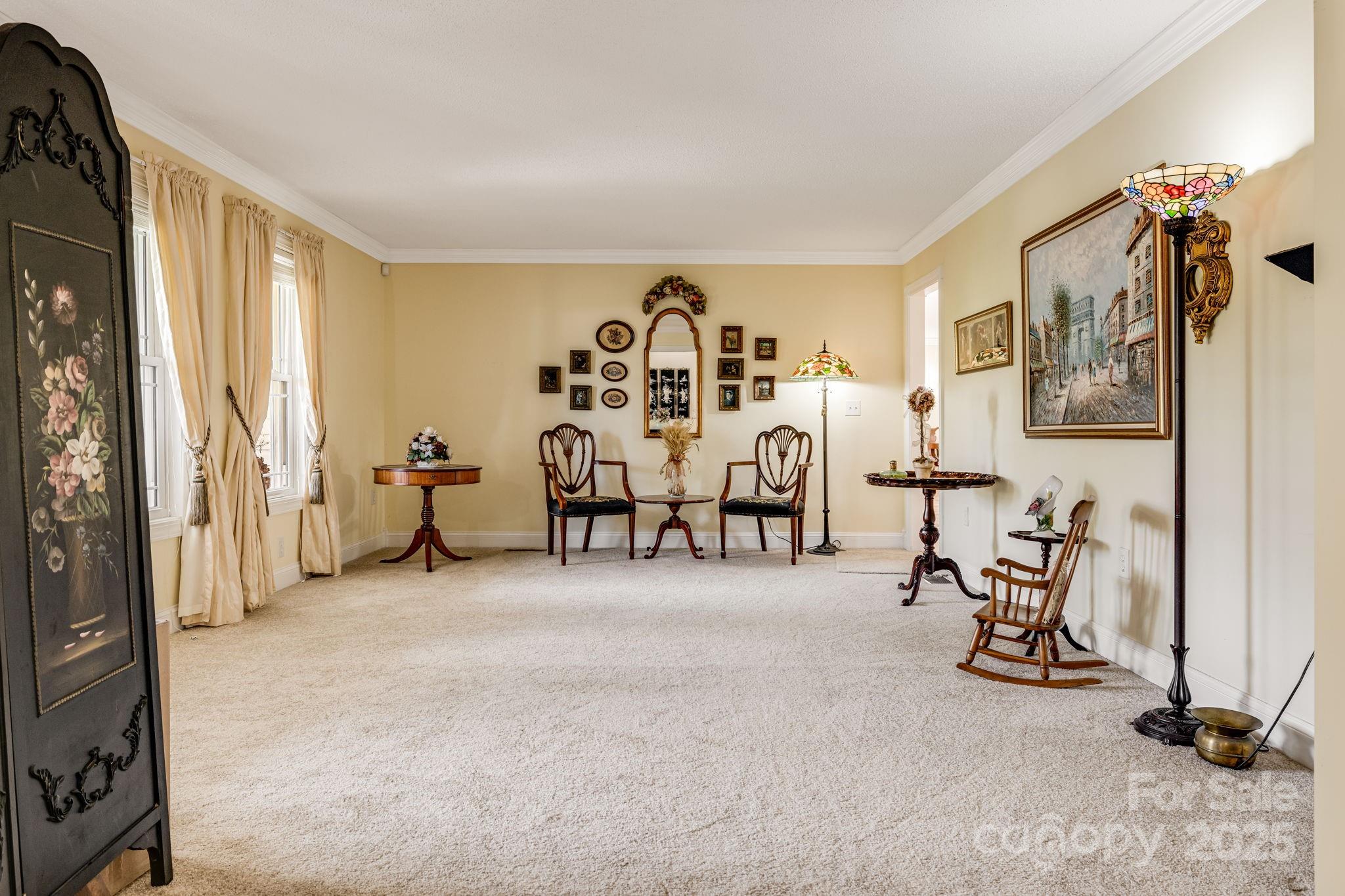 350 Old Sunset Hill Road Hendersonville, NC 28792 - Photo 2 of 40 a view of a livingroom with furniture and a flat screen tv