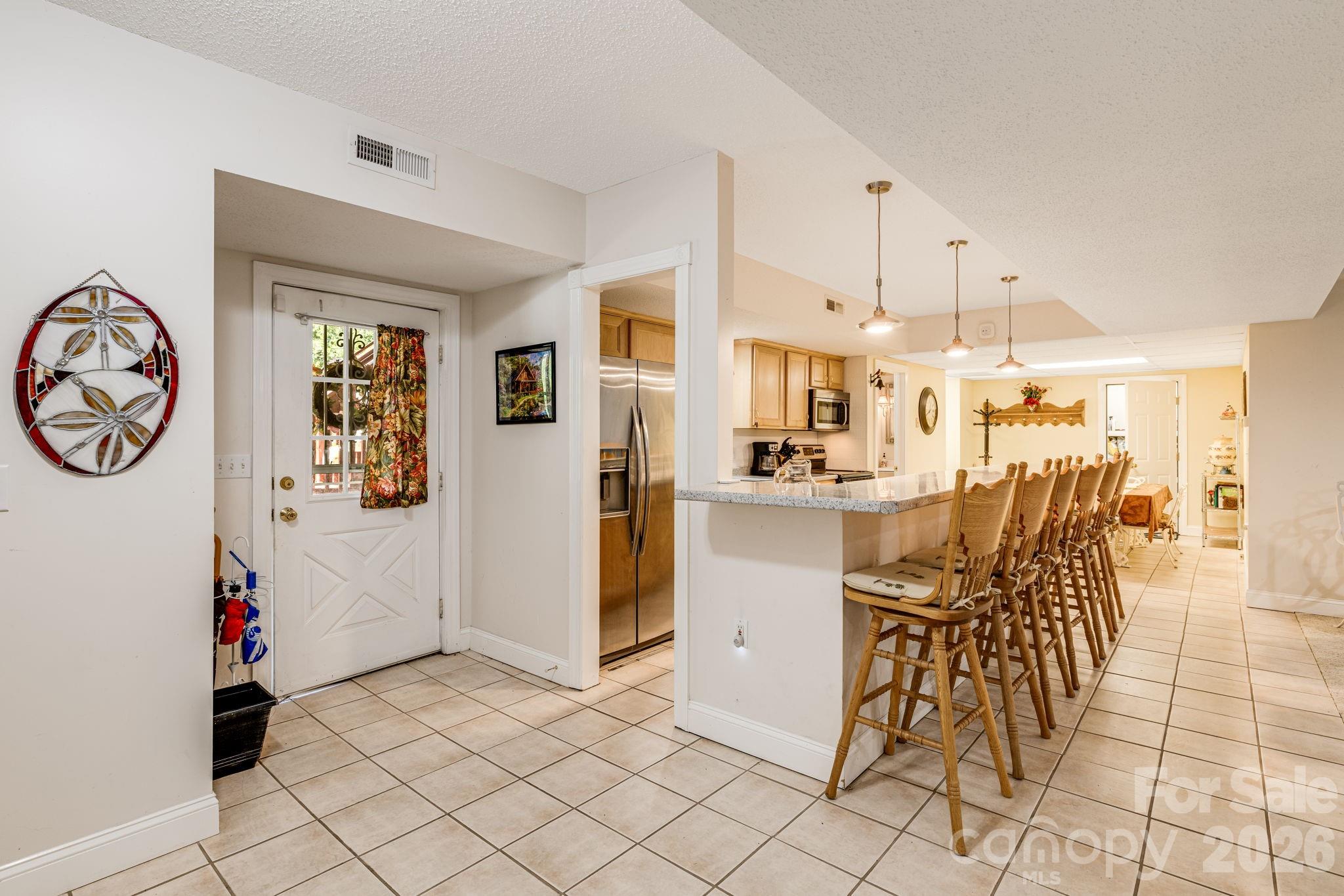 350 Old Sunset Hill Road Hendersonville, NC 28792 - Photo 22 of 40 a view of a dining room with furniture