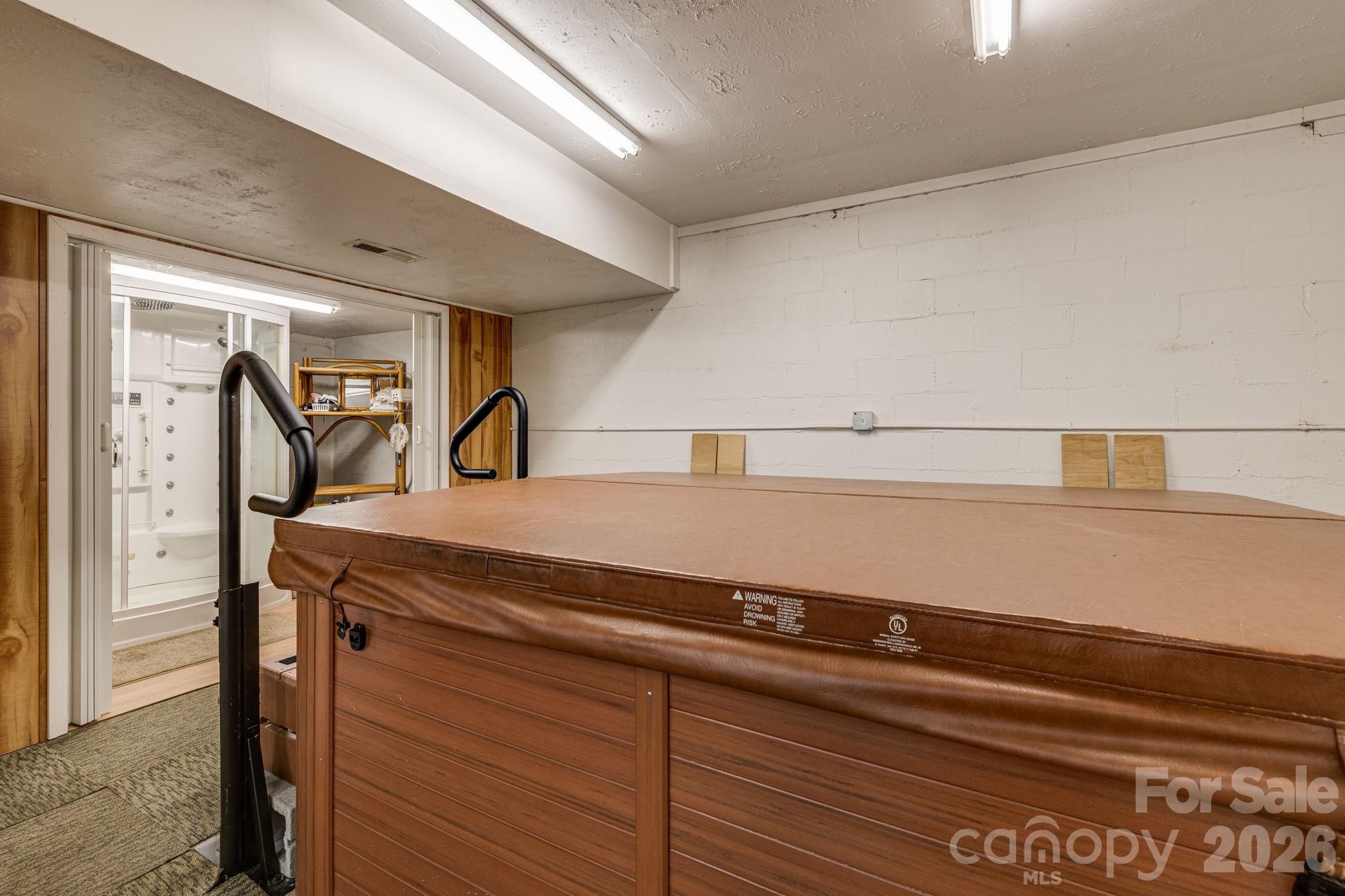 350 Old Sunset Hill Road Hendersonville, NC 28792 - Photo 28 of 40 a view of storage and utility room with washer and dryer