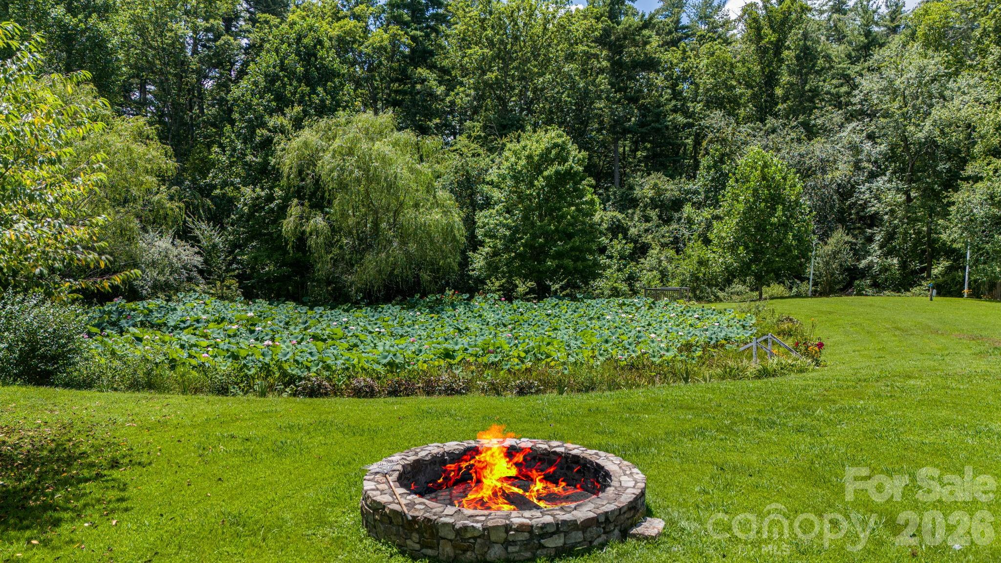 350 Old Sunset Hill Road Hendersonville, NC 28792 - Photo 30 of 40 a view of an outdoor space and a yard
