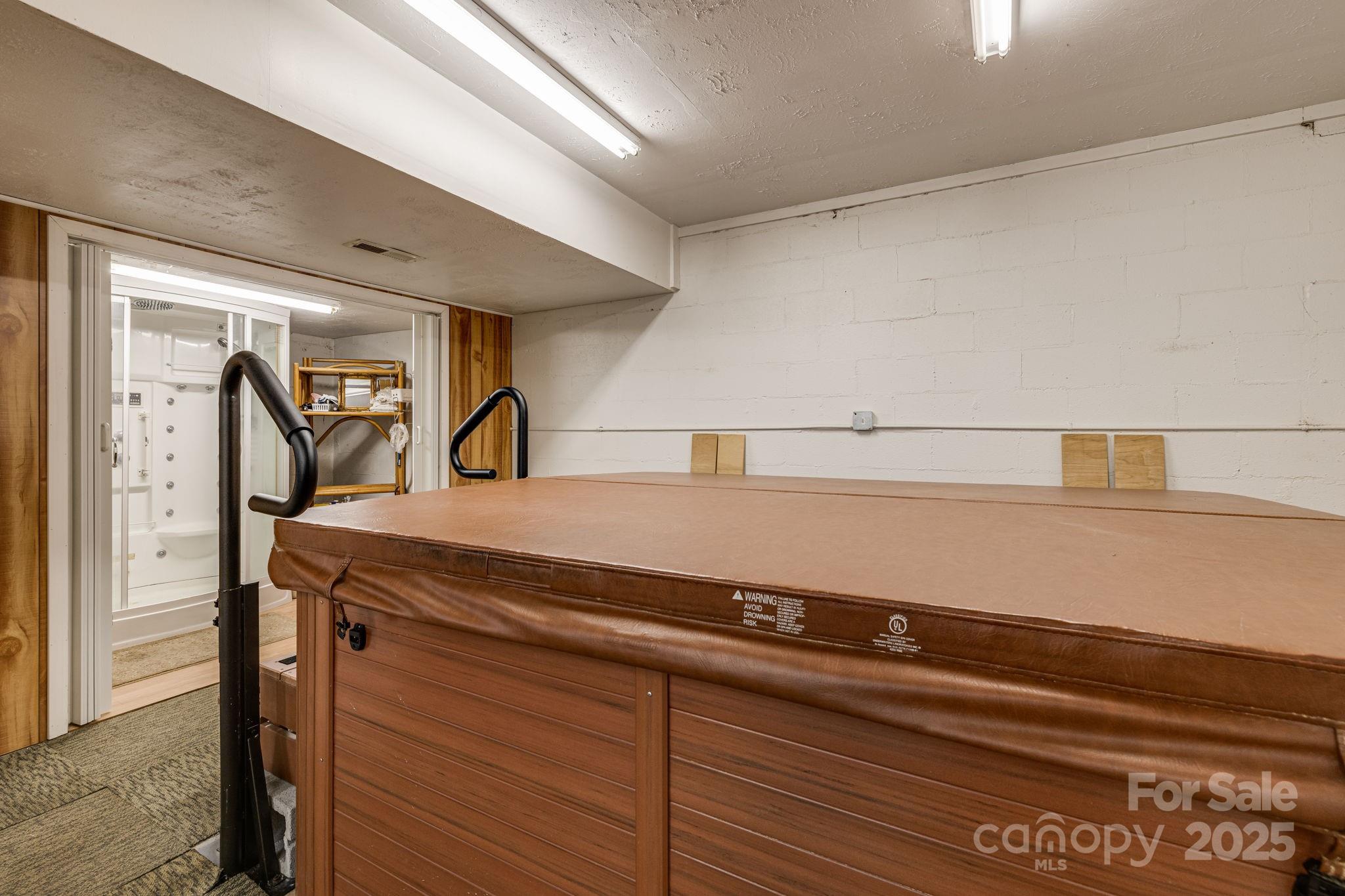 350 Old Sunset Hill Road Hendersonville, NC 28792 - Photo 30 of 40 a view of storage and utility room with washer and dryer