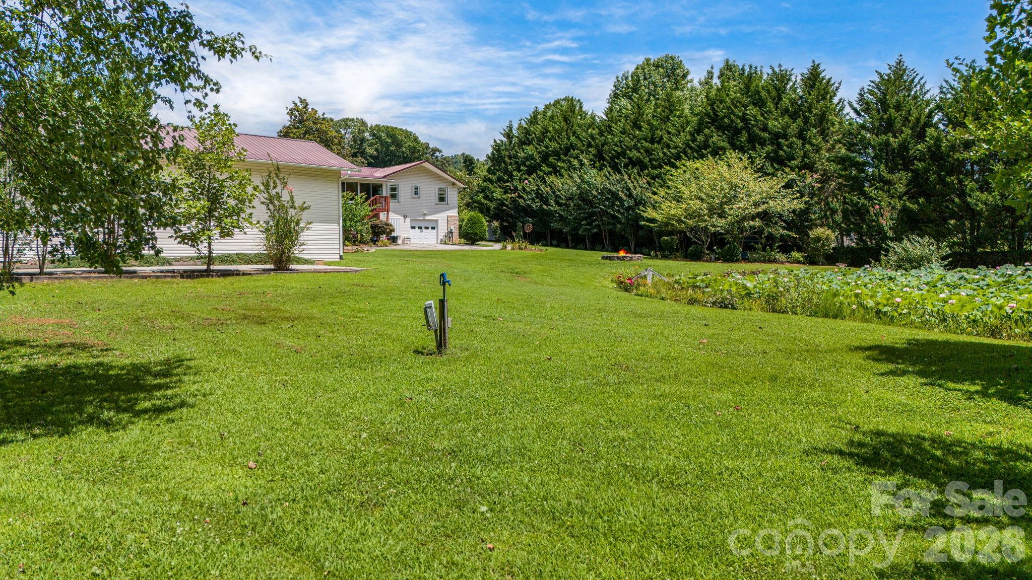 350 Old Sunset Hill Road Hendersonville, NC 28792 - Photo 34 of 40 a view of a house with a backyard