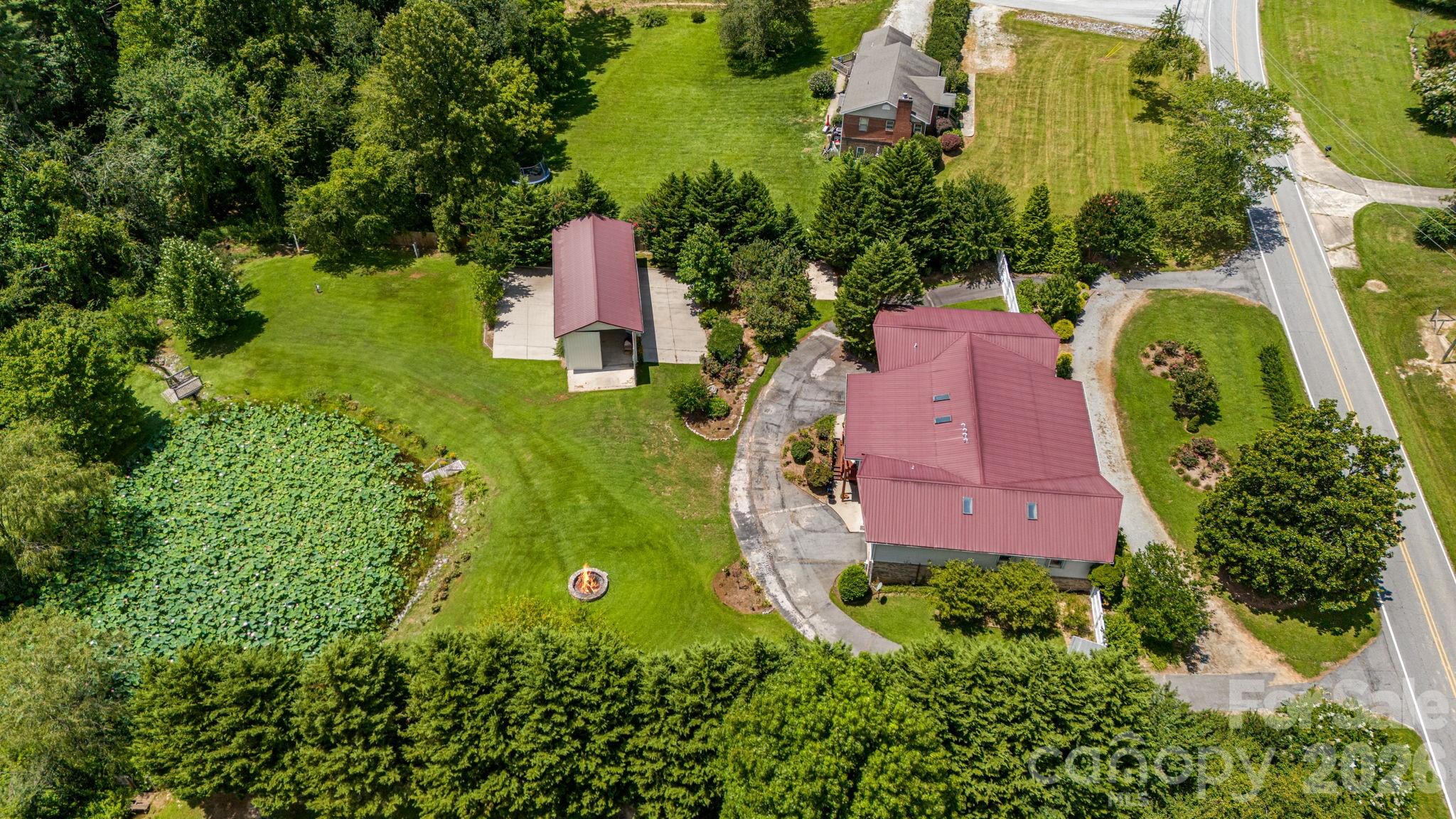 350 Old Sunset Hill Road Hendersonville, NC 28792 - Photo 37 of 40 an aerial view of a house with a garden