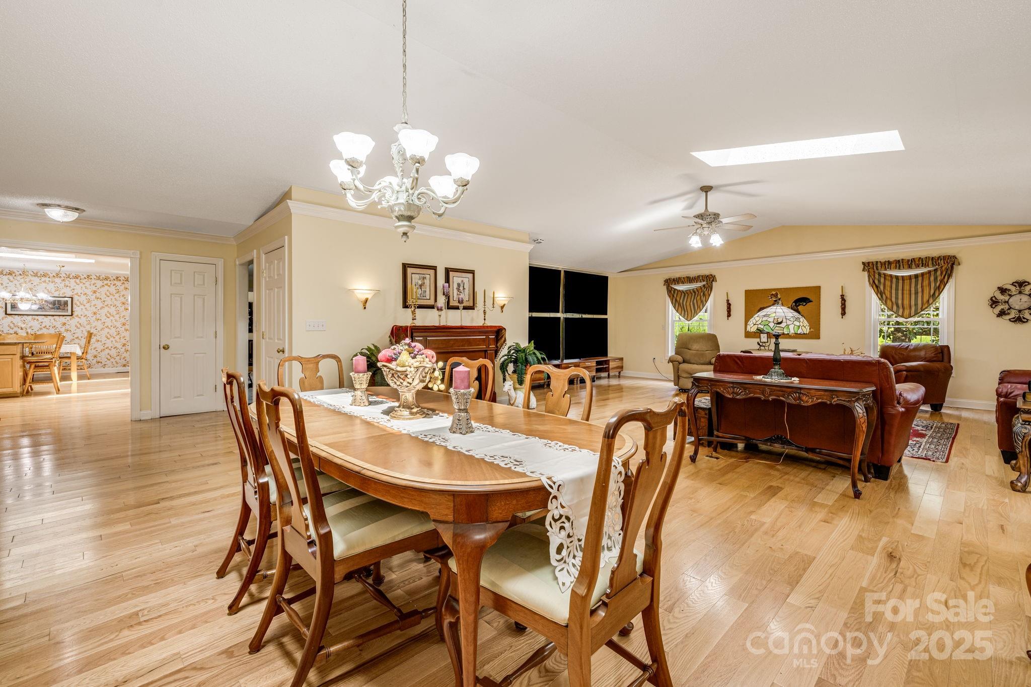 350 Old Sunset Hill Road Hendersonville, NC 28792 - Photo 9 of 40 a view of a dining room with furniture and wooden floor