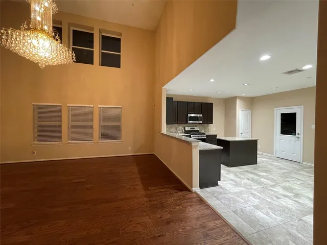 a kitchen with granite countertop a stove top oven and sink