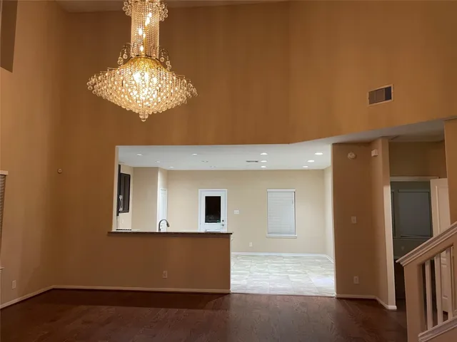 a view of a livingroom with a chandelier fan