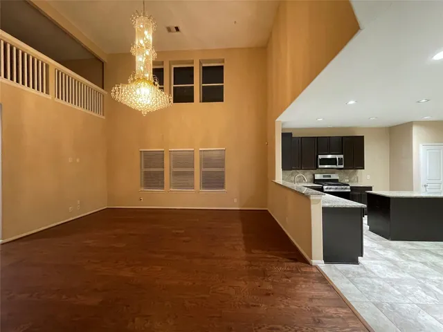 a kitchen with stainless steel appliances granite countertop a stove and a sink