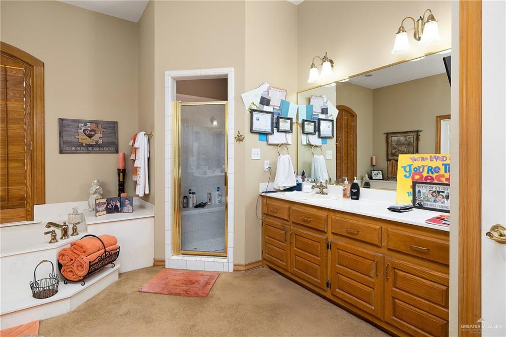 27603 Palo Verde Road San Benito, TX 78586 - Photo 20 of 45 a bathroom with a sink double vanity and a mirror