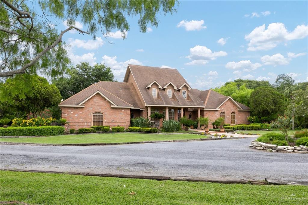 27603 Palo Verde Road San Benito, TX 78586 - Photo 2 of 45 a front view of house with yard and green space