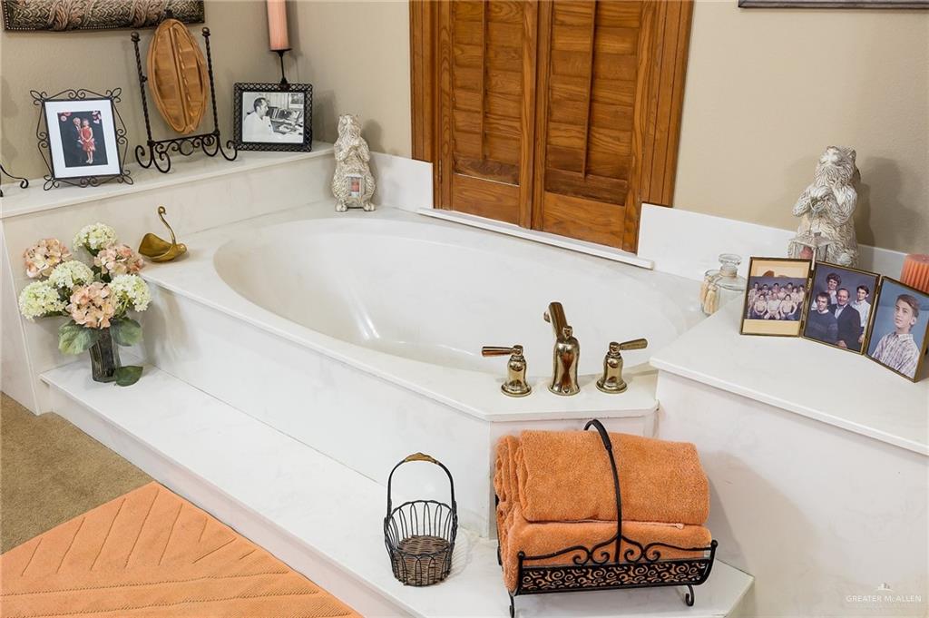 27603 Palo Verde Road San Benito, TX 78586 - Photo 21 of 45 a bathroom with a sink and a mirror