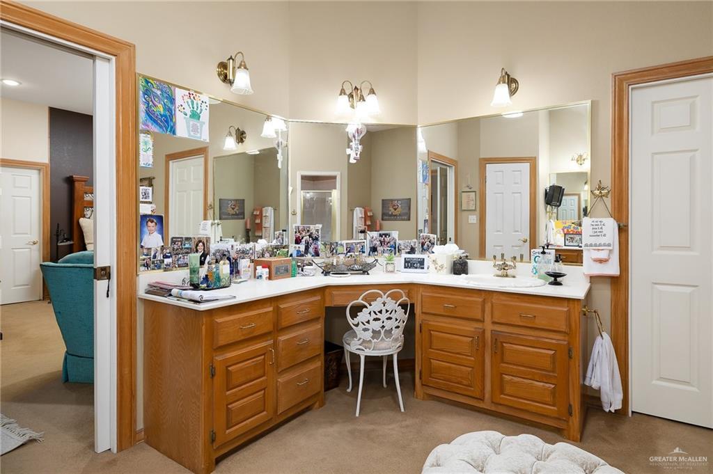 27603 Palo Verde Road San Benito, TX 78586 - Photo 22 of 45 a kitchen with stainless steel appliances granite countertop a sink and a refrigerator