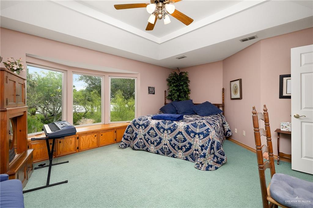 27603 Palo Verde Road San Benito, TX 78586 - Photo 25 of 45 a bed room with a bed and a chair