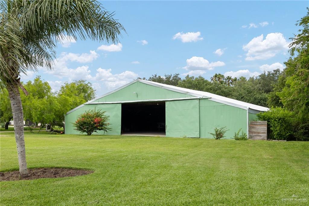 27603 Palo Verde Road San Benito, TX 78586 - Photo 30 of 45 a front view of house with yard and trees