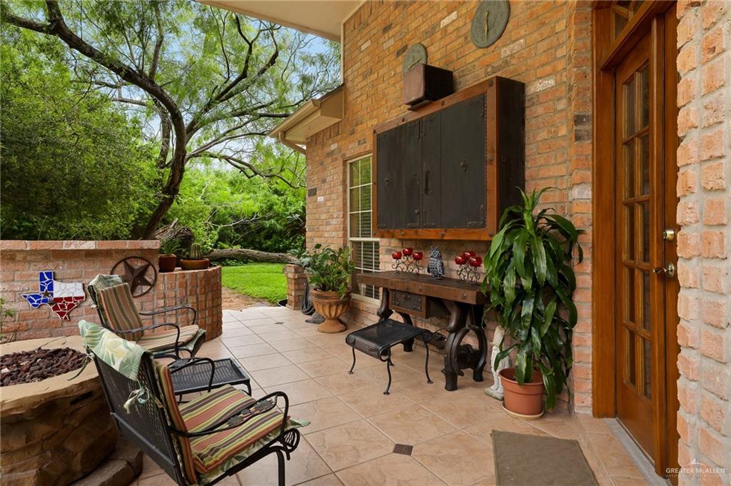 27603 Palo Verde Road San Benito, TX 78586 - Photo 34 of 45 a view of a patio with table and chairs and potted plants