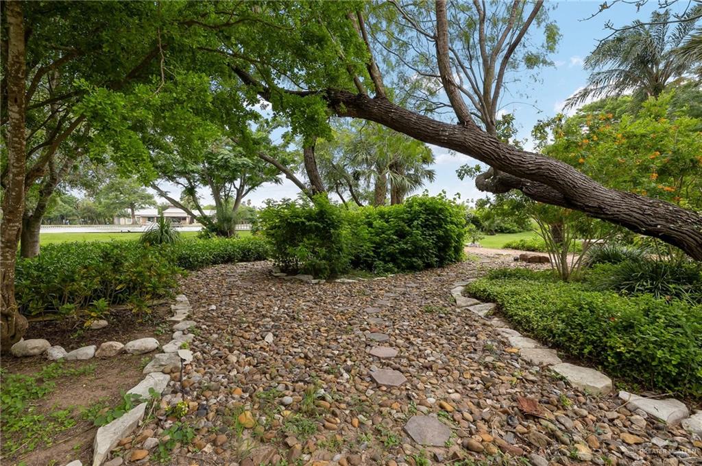 27603 Palo Verde Road San Benito, TX 78586 - Photo 40 of 45 a wooden bench with view of trees