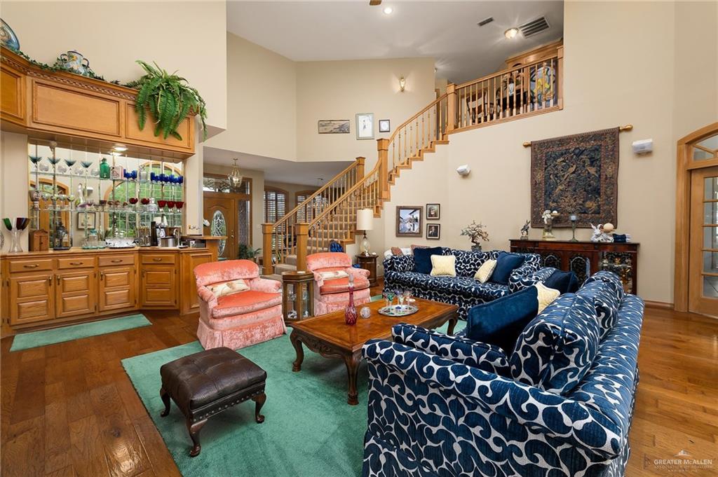 27603 Palo Verde Road San Benito, TX 78586 - Photo 6 of 45 a living room with furniture a rug and a floor to ceiling window