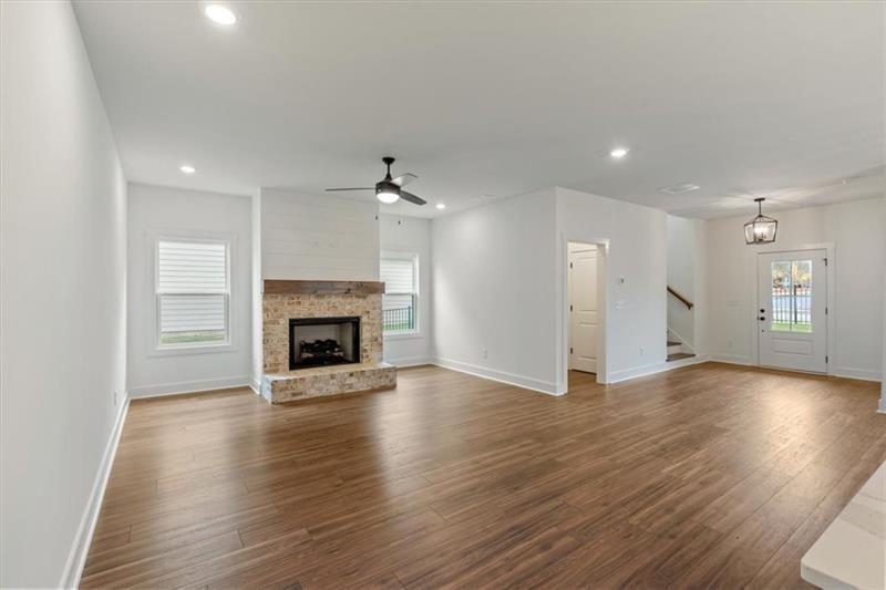 131 Old Alabama Road Southeast Emerson, GA 30137 - Photo 16 of 44 a view of an empty room with wooden floor fireplace and a window
