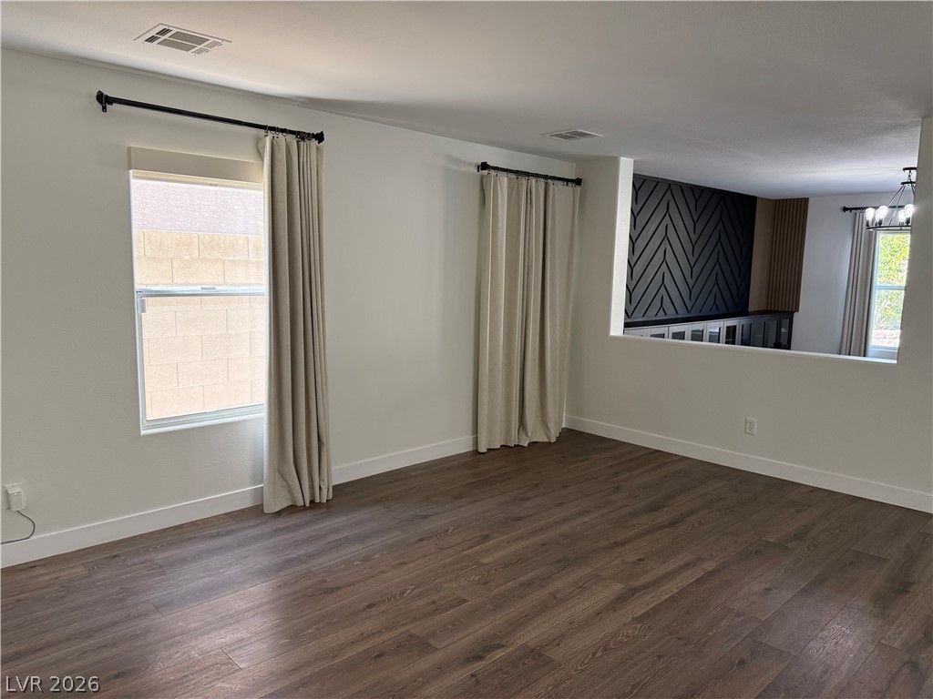 1141 Cathedral Ridge Street Henderson, NV 89052 - Photo 6 of 77 This versatile room features warm flooring and natural light, perfect for flexible living.