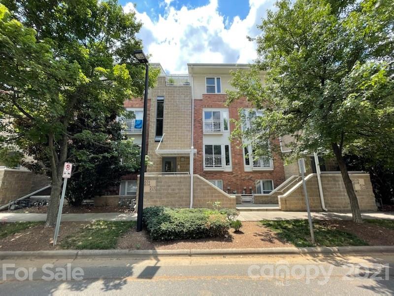 632 Raphael Place Charlotte, NC 28205 - Photo 2 of 37 a front view of a house with a garden