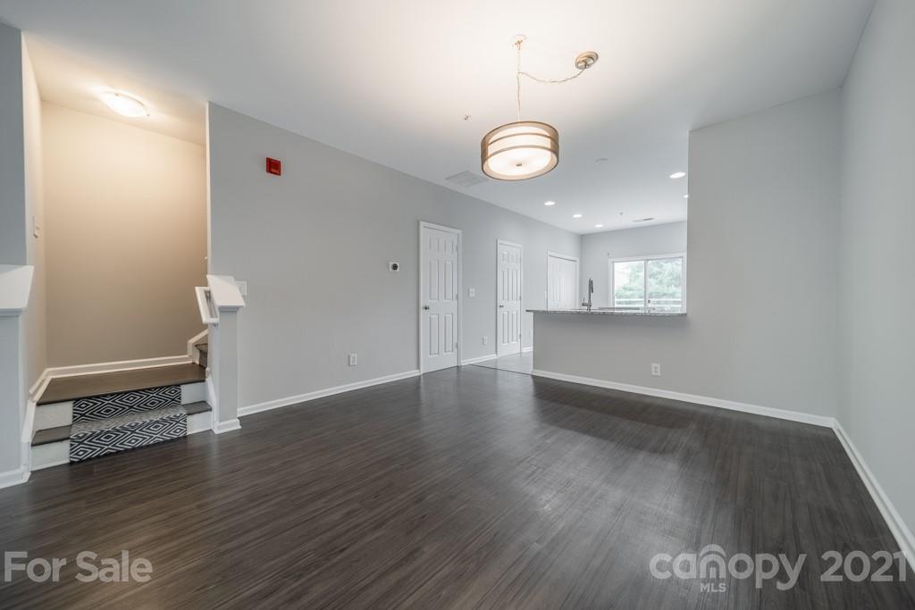 632 Raphael Place Charlotte, NC 28205 - Photo 11 of 37 a view of an empty room with wooden floor and a window