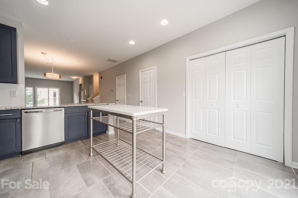 632 Raphael Place Charlotte, NC 28205 - Photo 17 of 37 a view of kitchen with center island and stainless steel appliances