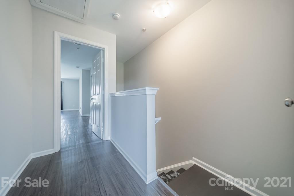 632 Raphael Place Charlotte, NC 28205 - Photo 21 of 37 a view of a hallway with wooden floor