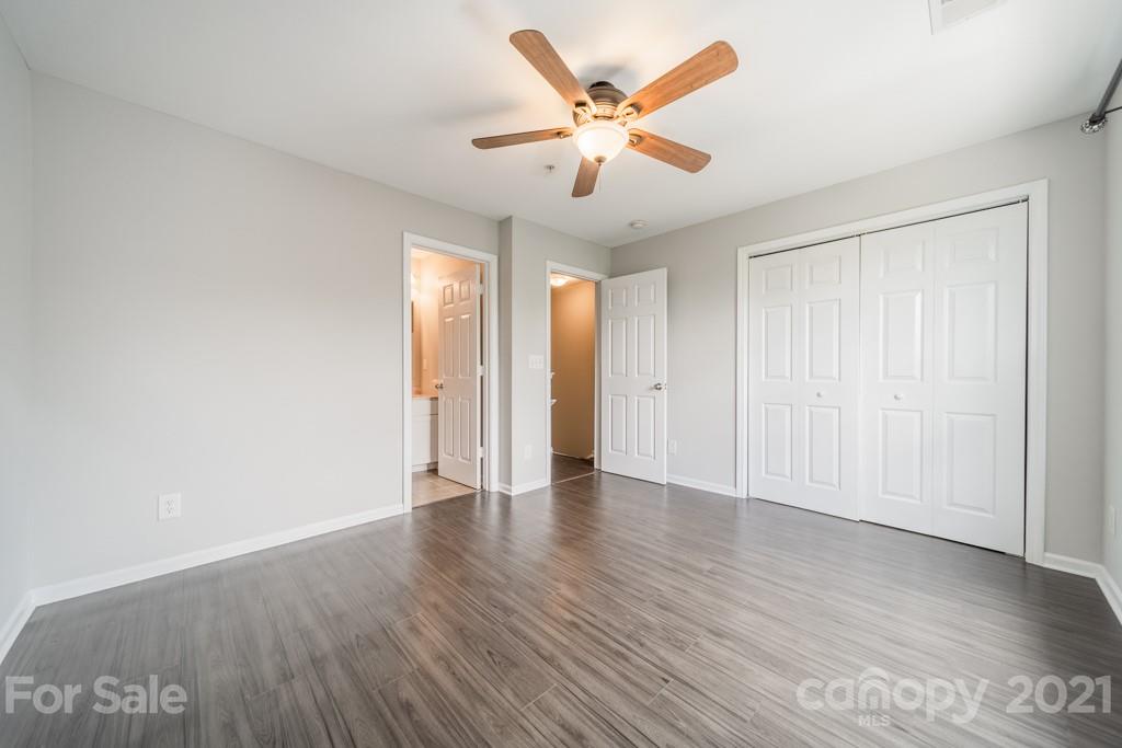 632 Raphael Place Charlotte, NC 28205 - Photo 24 of 37 an empty room with wooden floor and windows