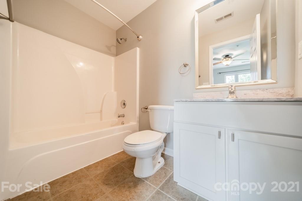 632 Raphael Place Charlotte, NC 28205 - Photo 25 of 37 a bathroom with a sink toilet and shower