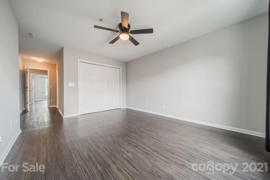 632 Raphael Place Charlotte, NC 28205 - Photo 27 of 37 a view of a room with wooden floor and white walls