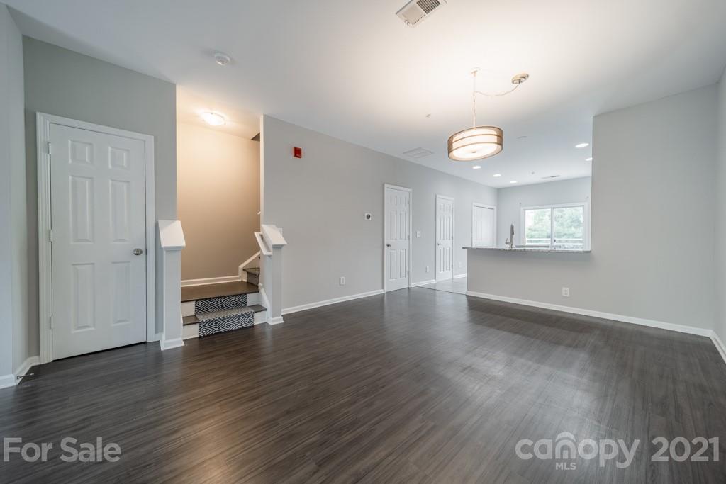 632 Raphael Place Charlotte, NC 28205 - Photo 10 of 37 an empty room with wooden floor and windows