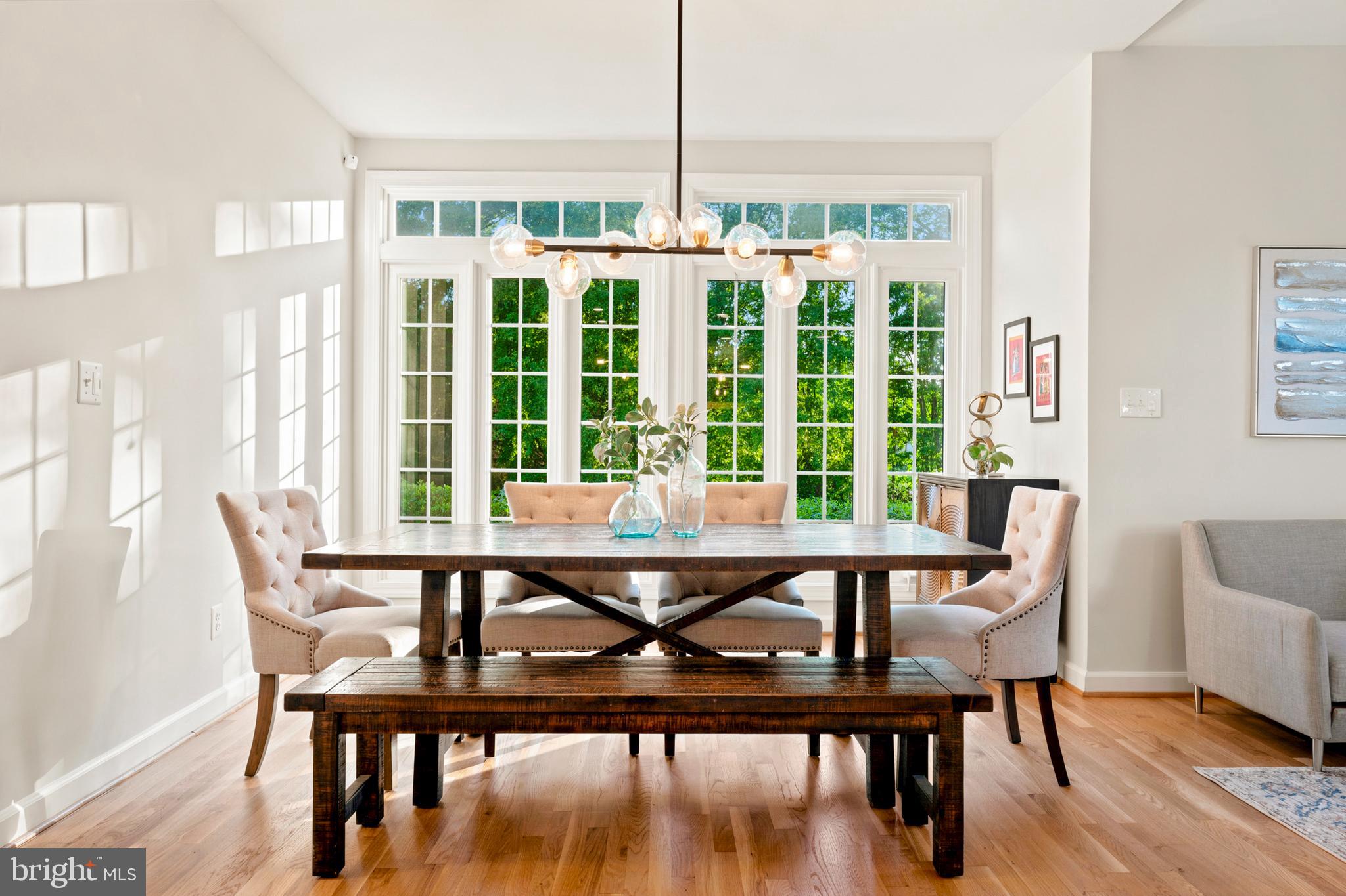 9313 Harrisons Farm Way Laytonsville, MD 20882 - Photo 25 of 77 a view of a dining room with furniture window and wooden floor