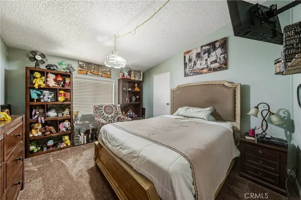 a bed room with a bed and a baby bed